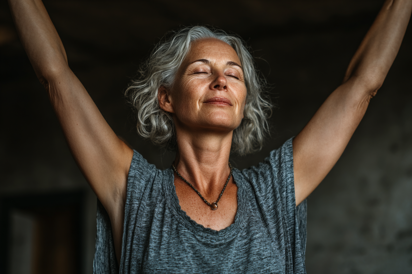 Mature woman practicing gentle yoga in serene studio setting